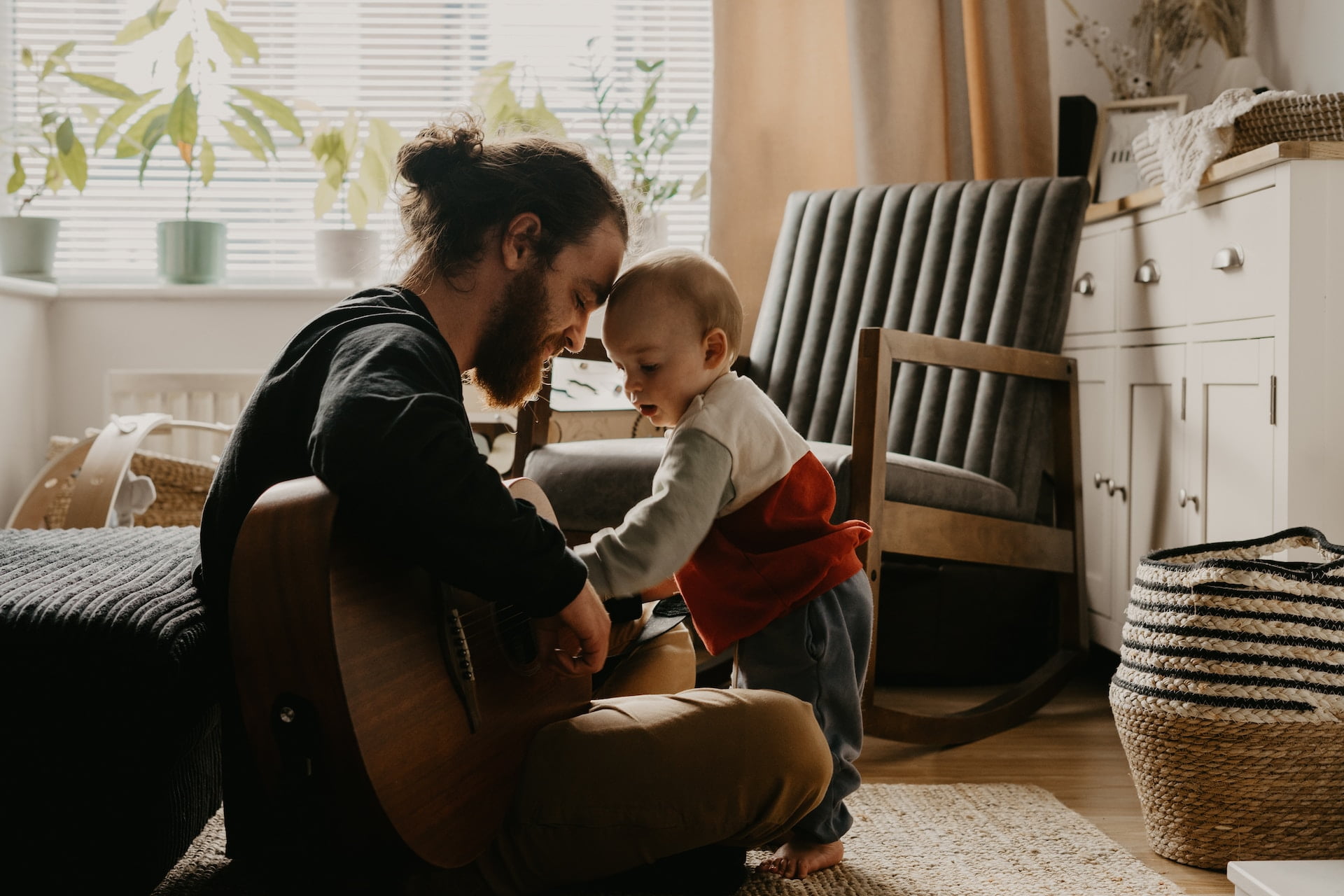 dad playing guitar, bonding with baby