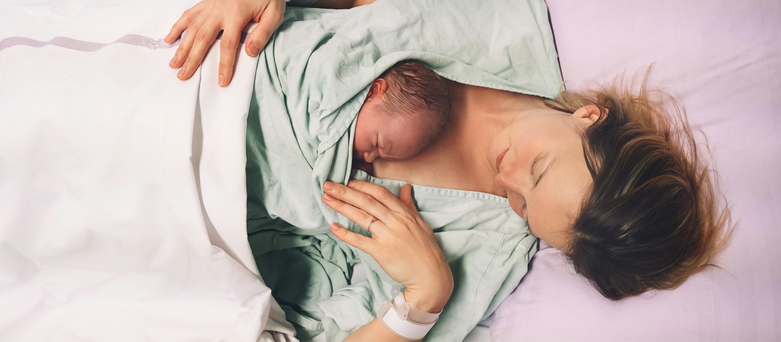 birth trauma hero, mother cradling baby